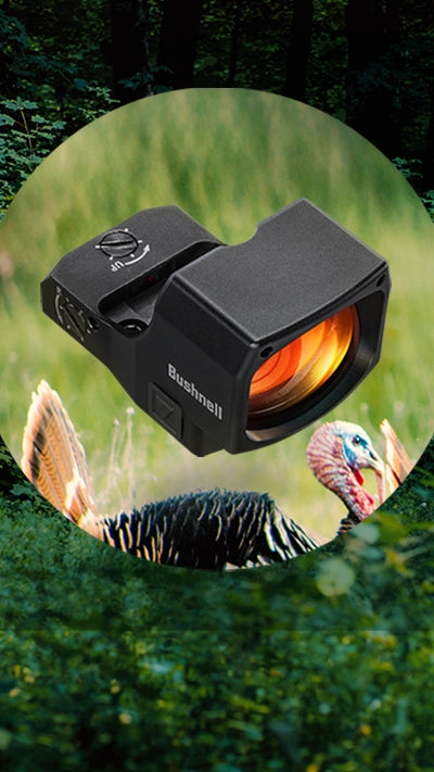 A Bushnell red dot sight is superimposed over a circular inset showing a wild turkey in a green, forested area. The background is filled with dense foliage and trees.