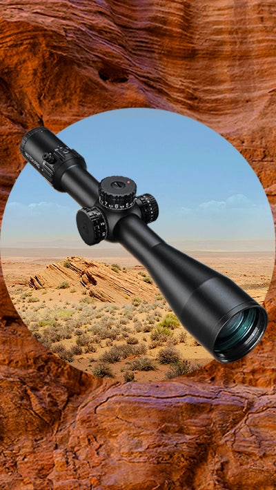 A rifle scope is centered over a desert landscape with rocky hills and sparse vegetation, framed by a circular cutout against a textured, reddish-brown rock background.