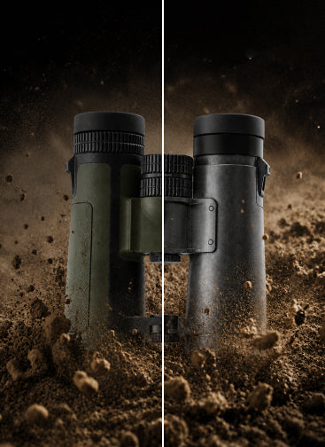 A pair of binoculars shown vertically split down the middle, with one half in matte olive green and the other half in matte black, both resting in dark, dusty soil against a dark background.