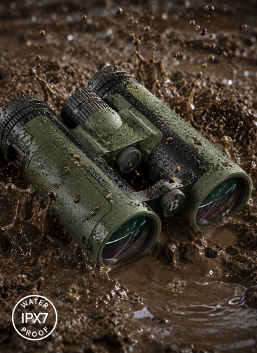 Bushnell R7 binocular in wet mud and splashing water illustrating IPX7 construction