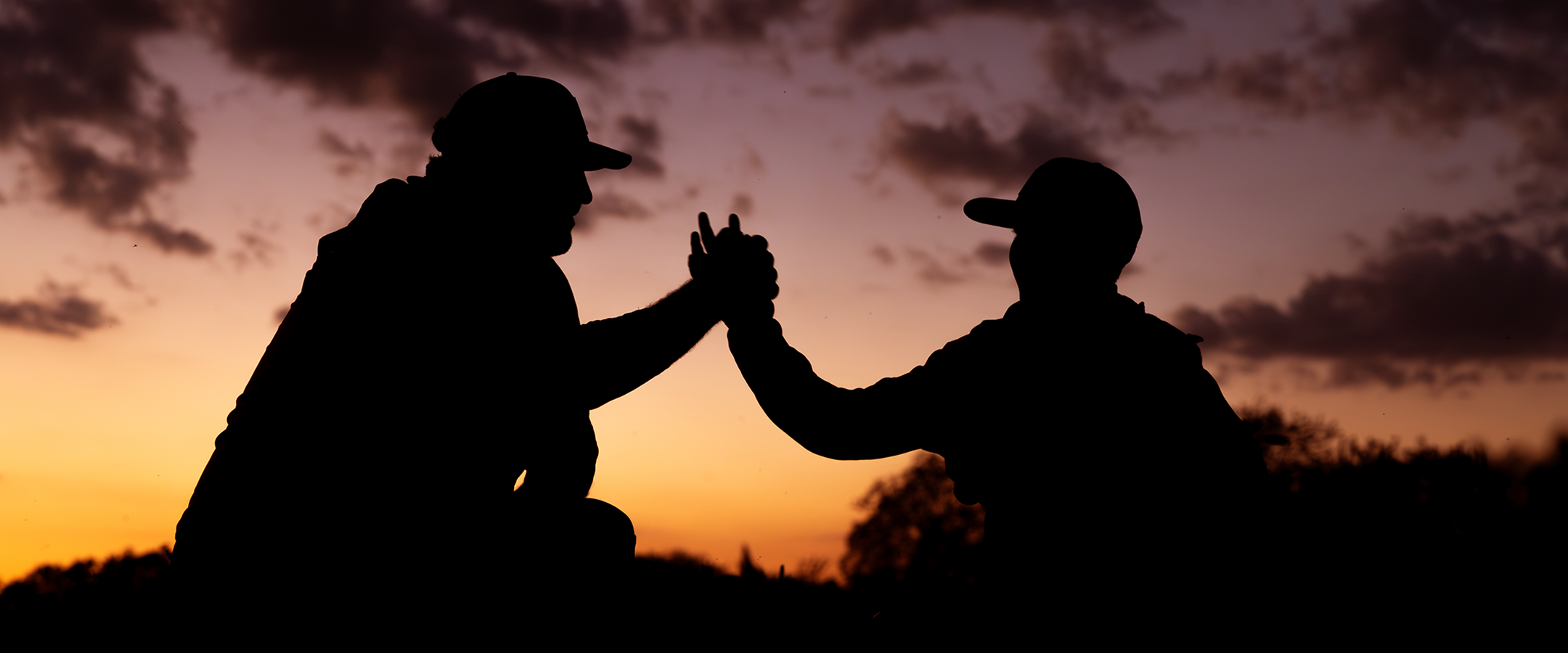 Father and son high fiving