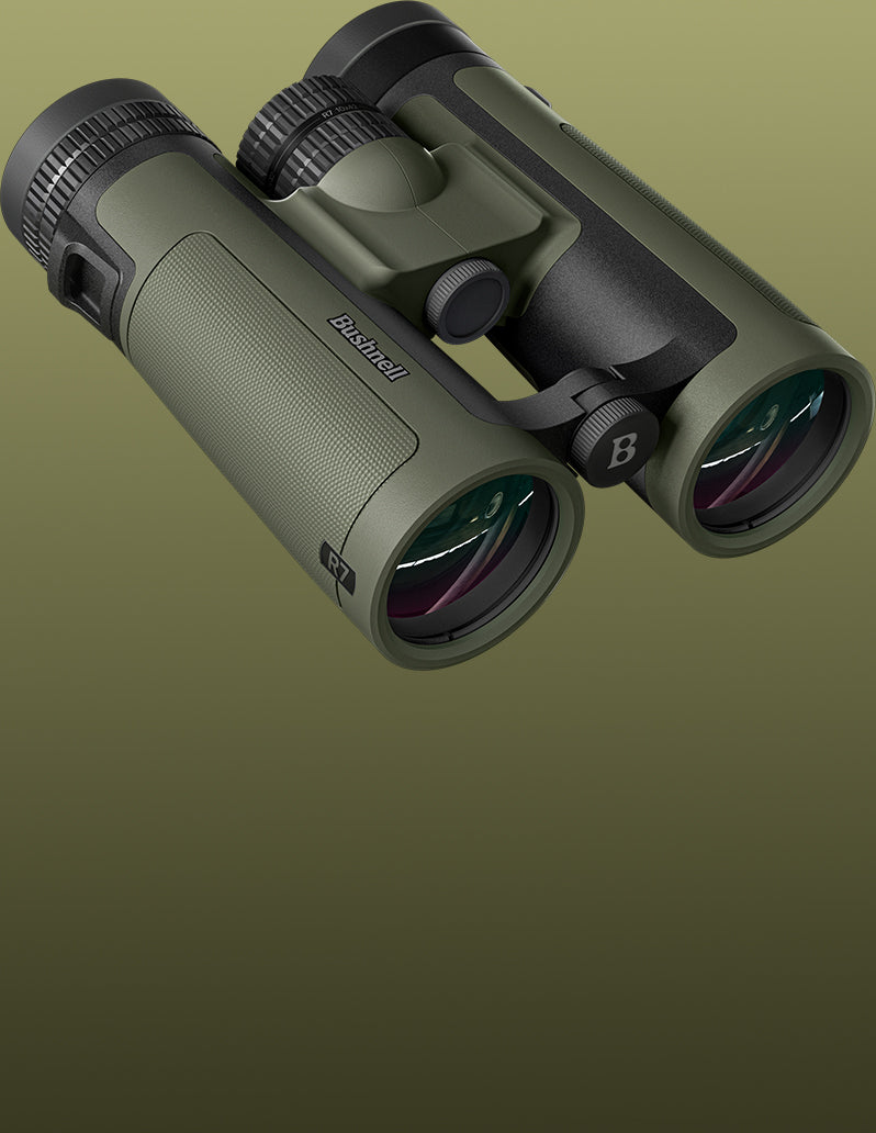 A pair of binoculars in olive green and black, shown floating against a solid olive green gradient background. The brand name 'Browning' is visible on the side of the left eyecube.