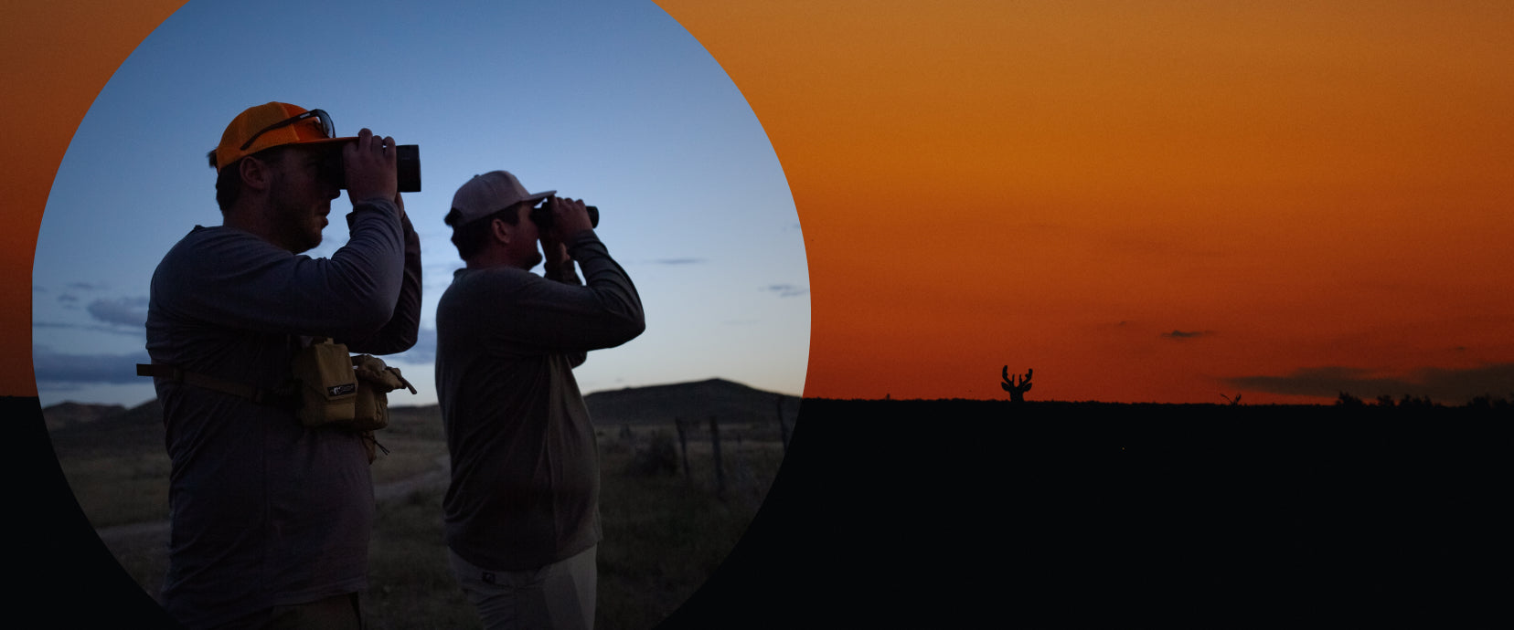 Two people taking photos of a sunset with binoculars.