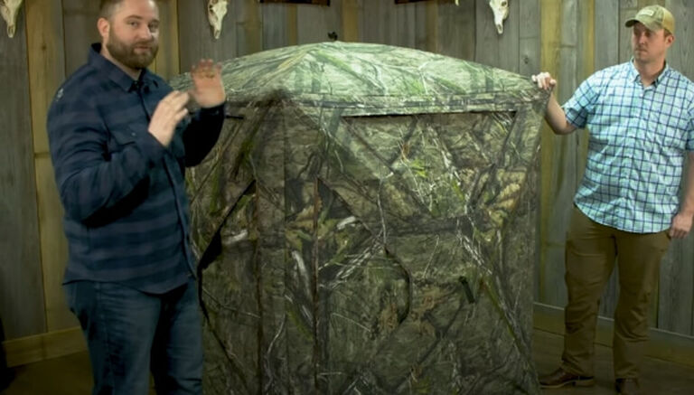 Two people demonstrating the Primos Double Bull® Roughneck™ Ground Blind