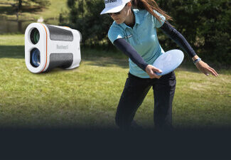 Edge Laser Rangefinder with woman throwing a disc golf driver