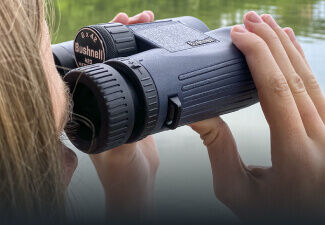 Person looking through H2O Waterproof Binoculars
