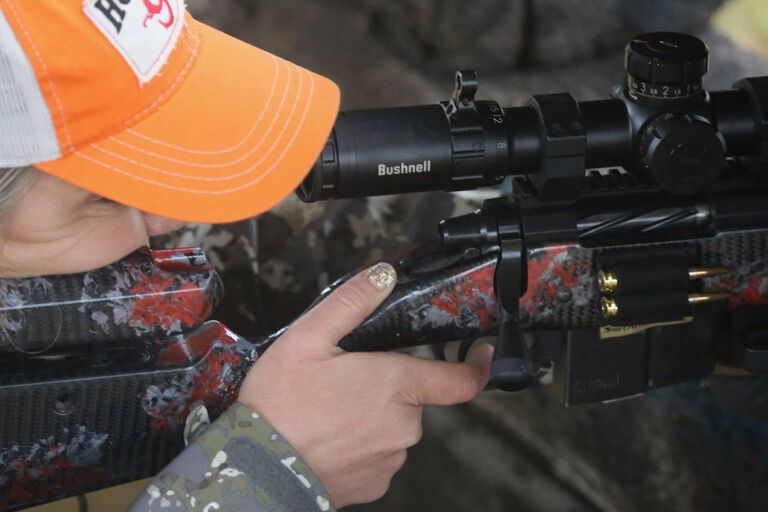 Missy with Hoppes hat and rifle. 