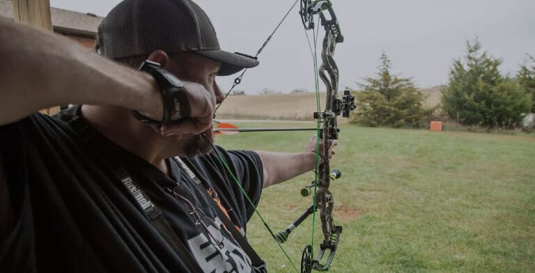 T-Bone Turner at a range aiming bow at target