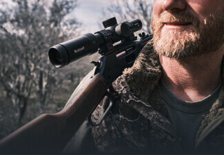 Hunter with Trophy Quick Acquisition Riflescope mounted on rifle