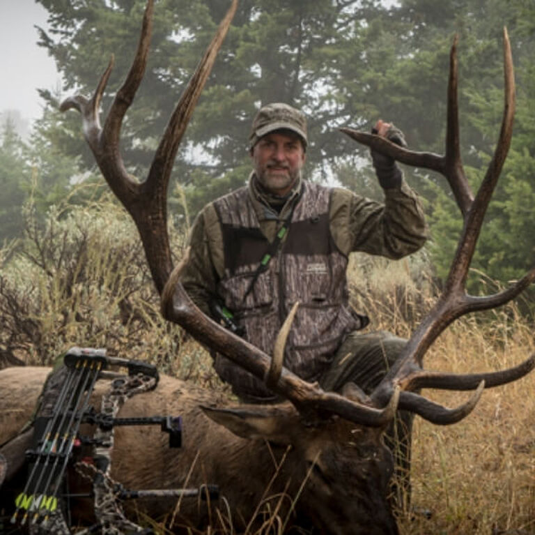 Portrait of Will Primos posing with elk