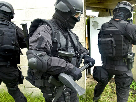 Police officers in tactical gear training
