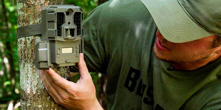 Hunter adjusting Prime Low Glow Trail Camera