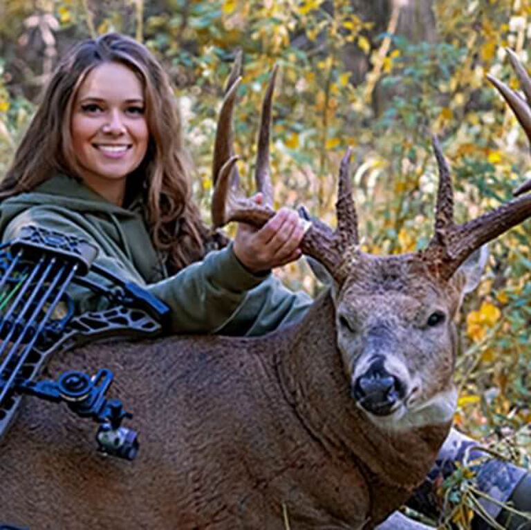 Portrait of Kaitlyn Maus posing with deer