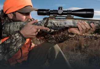 Hunter sighting-in his rifle with a Bushnell Riflescope