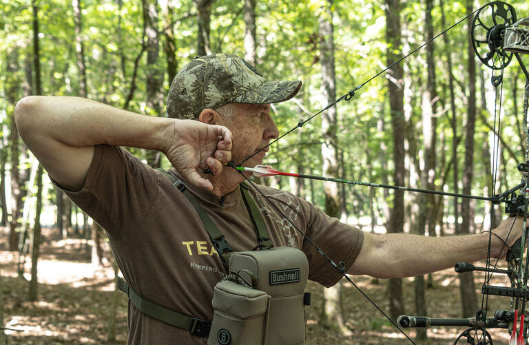 bowhunter using sights