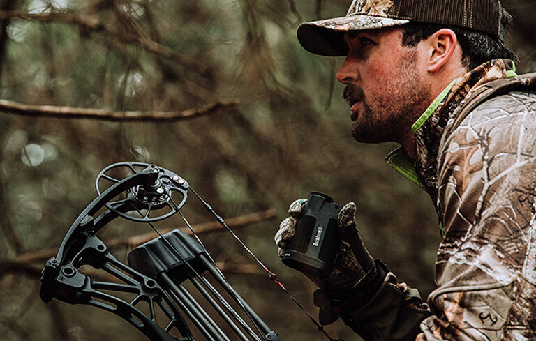 Bow hunter holding Prime 1800