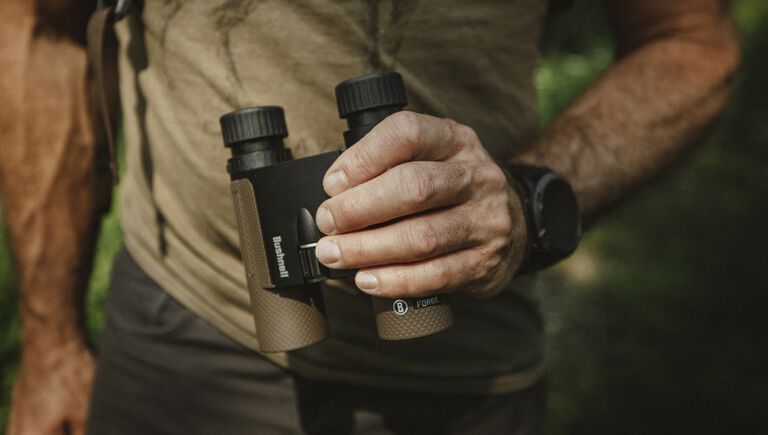 man holding a pair of binoculars