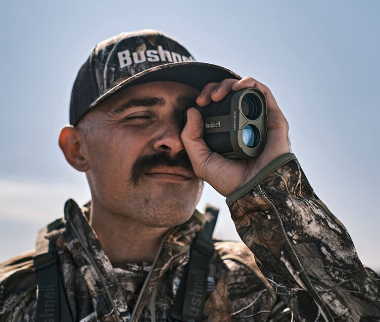 Hunter looking through Broadhead Laser Rangefinder