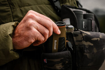 Man using Bushnell rangefinder