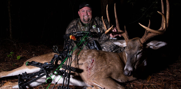 Bowhunter with whitetail Bowhunter with whitetail