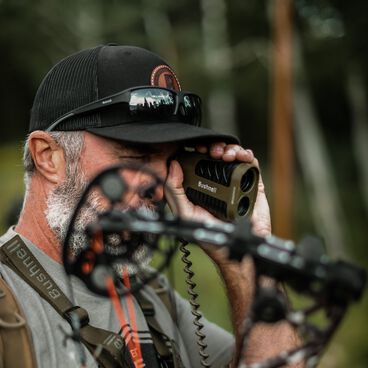 Man using Bushnell rangefinder