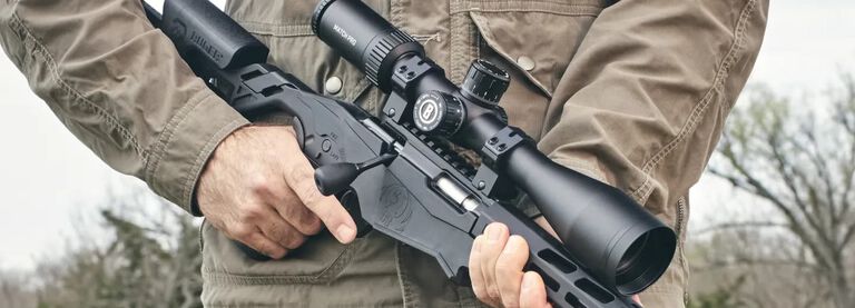 Man Holding Rifle with Match Pro