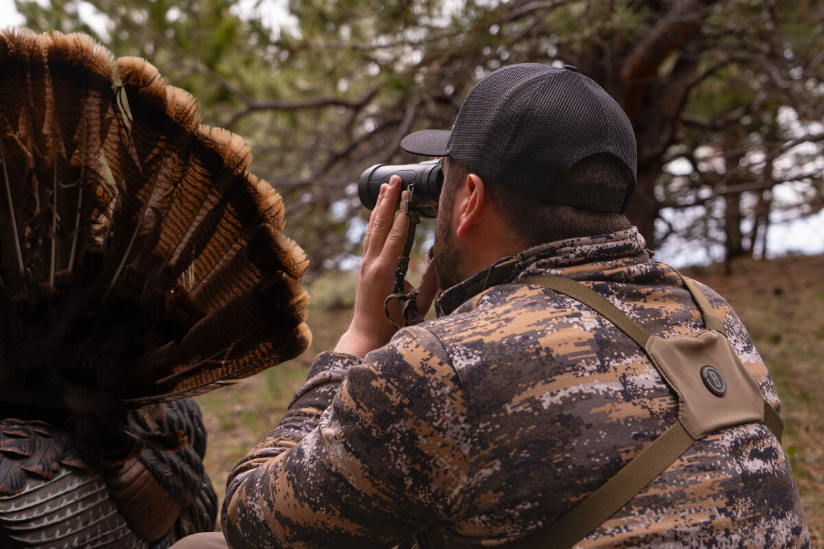 Turkey Hunter in a using binoculars