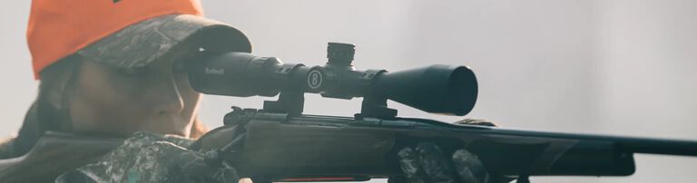 Jesse Harrison aiming with a Bushnell scope