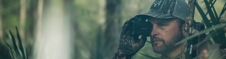 Michael holding a Bushnell rangefinder