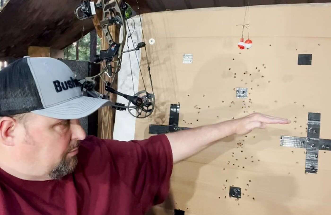 T-Bone Turner pointing out groupings on a target