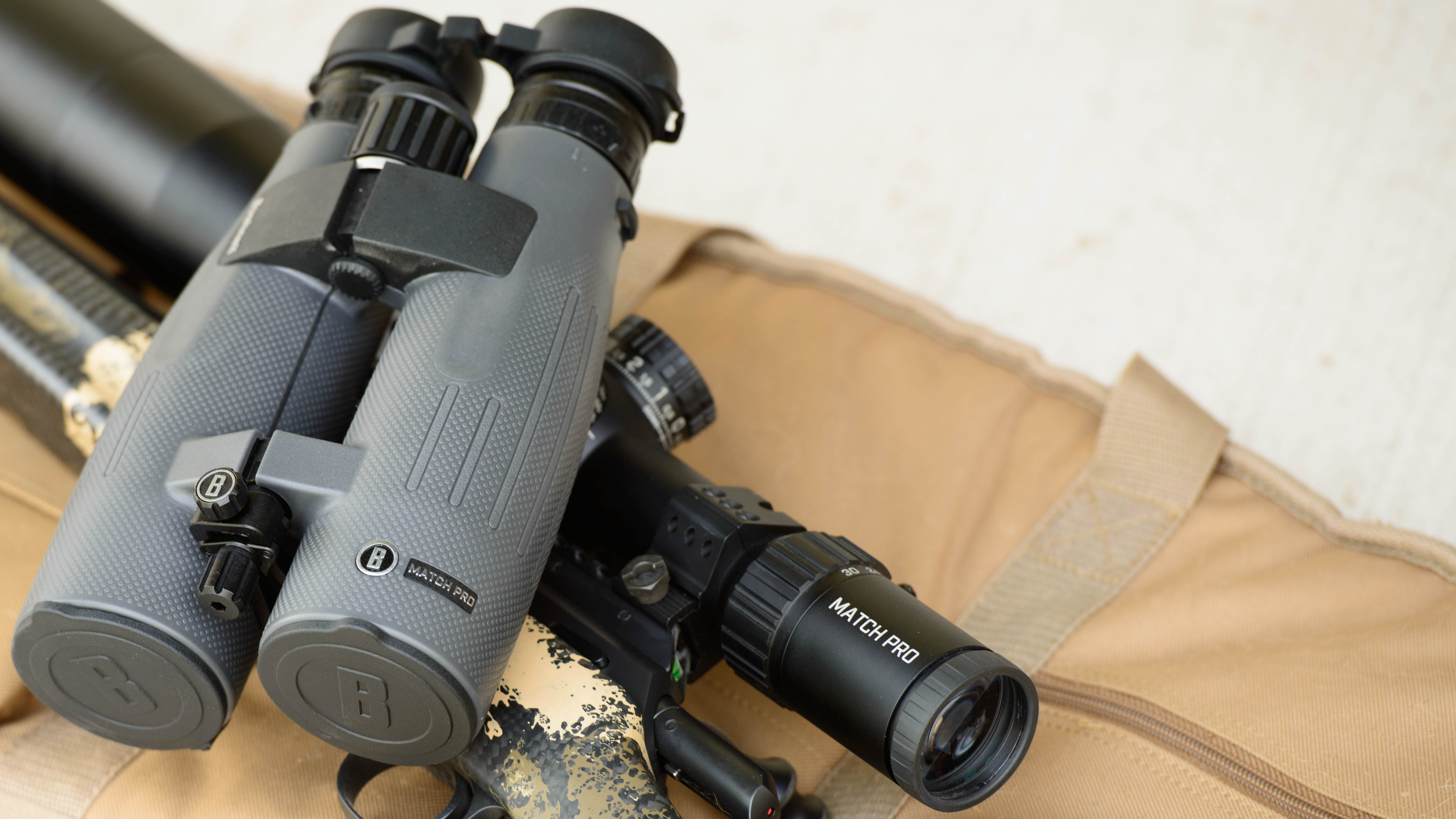 Competition target shooter aiming through Match Pro Riflescope