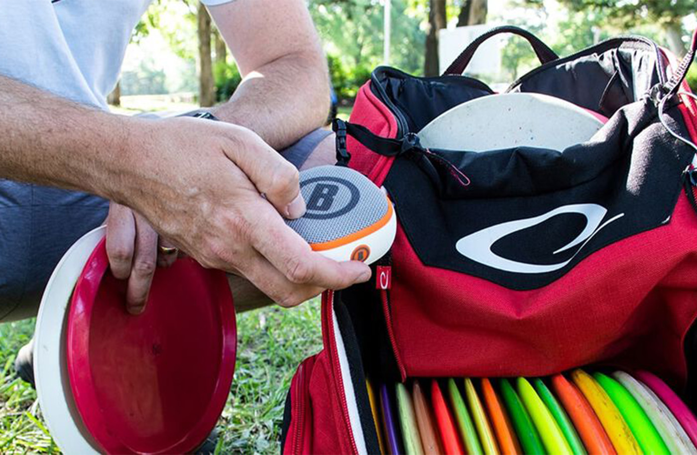 The Bushnell DJ with a bunch of disc golf discs.